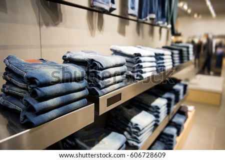 stack of blue jeans in a shop.