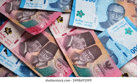 Stack of Blue One Hundred Thousand Rupiah and Fifty Thousand Rupiah Banknotes. Close-up photo of One Hundred Thousand Rupiah and Fifty Thousand Rupiah banknotes. Indonesian Currency