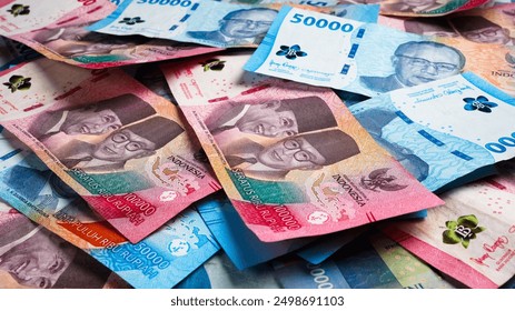 Stack of Blue One Hundred Thousand Rupiah and Fifty Thousand Rupiah Banknotes. Close-up photo of One Hundred Thousand Rupiah and Fifty Thousand Rupiah banknotes. Indonesian Currency