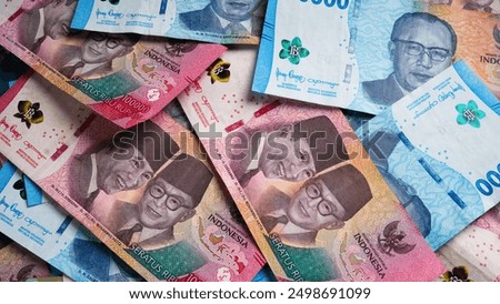 Stack of Blue One Hundred Thousand Rupiah and Fifty Thousand Rupiah Banknotes. Close-up photo of One Hundred Thousand Rupiah and Fifty Thousand Rupiah banknotes. Indonesian Currency