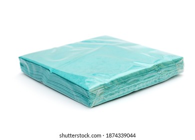 Stack Of Blue Paper Napkins In Transparent Pack. Isolated On White.