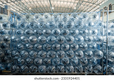 Stack of Blue Plastic Bottle in the Water Factory Warehouse