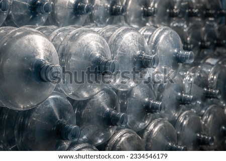stack of blue plastic bottles
