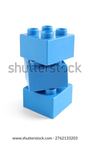 Stack of blue plastic building blocks on white background