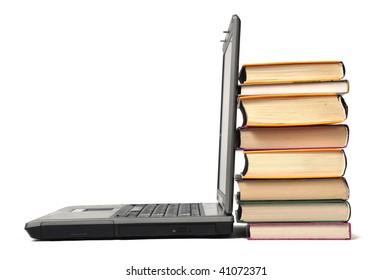 Stack of book and laptop over white