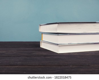 A stack of book on blue background with copy space. concept of education and training. - Shutterstock ID 1822018475