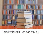 stack of books against the background of library, stack of books in front of library, books on wooden table, High quality book photography