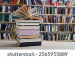 stack of books against the background of library, stack of books in front of library, books on wooden table, education, High quality book photography, Best Book Photo, AI, Vienna; Southwark;Longford