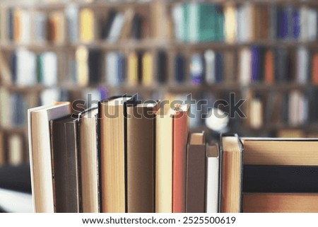 stack of books against the background of library, stack of books in front of library, books on wooden table, education, High quality book photography, Best Book Photo, AI