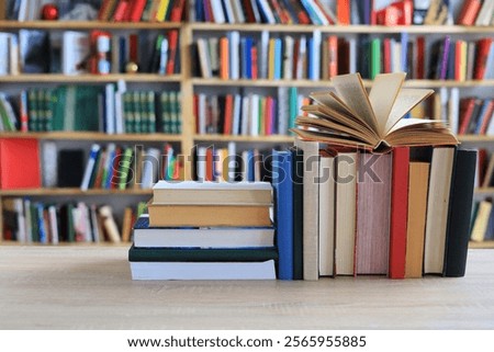 stack of books against the background of library, stack of books in front of library, books on wooden table, education, High quality book photography, Best Book Photo, AI, Vienna; Southwark;Longford