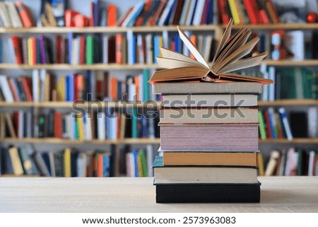 stack of books against the background of library, stack of books in front of library, books on wooden table, education, High quality book photography, Best Book Photo, AI, Vienna; Southwark;Longford