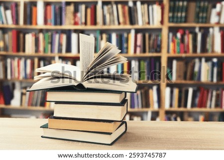 stack of books against the background of library, stack of books in front of library, books on wooden table, education, High quality book photography, Best Book Photo, AI, Vienna; Southwark;Longford