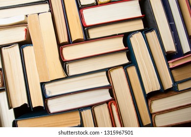 Stack of books background. many books piles.