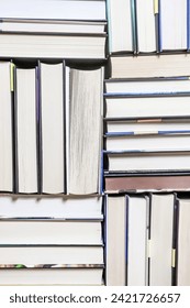 stack of books, close up. Open book on the table in library. Back to school concept. Open book on table with blur bookshelf background