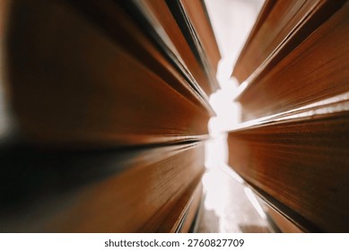 Stack Of Books Close Up. Reading and learning concepts.Close-up of book pages and sun glare. Books in the suns rays. 