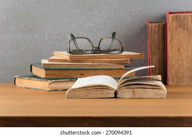 stack of books with glasses - Shutterstock ID 270094391