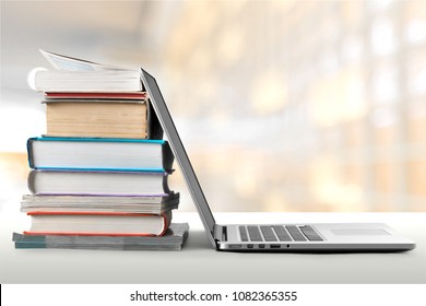 Stack Of Books With Laptop