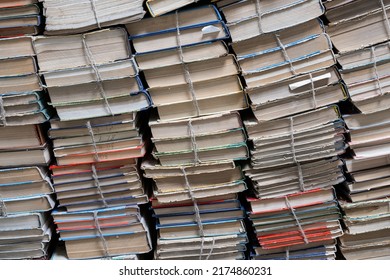 Stack of books in library. Book texture. Different vintage books in row. Literature, reading concept. old books row background