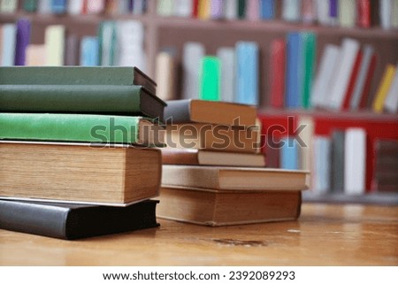 stack of books in library on blurred background