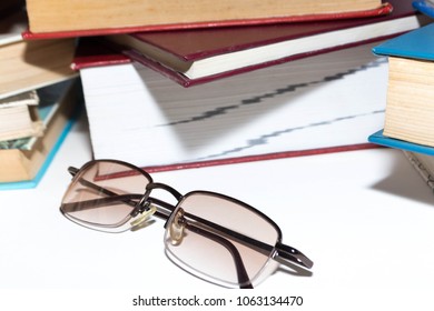 A stack of books on the background