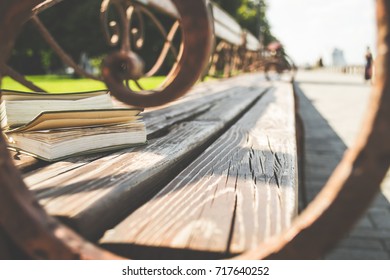 stack of books on a bench
