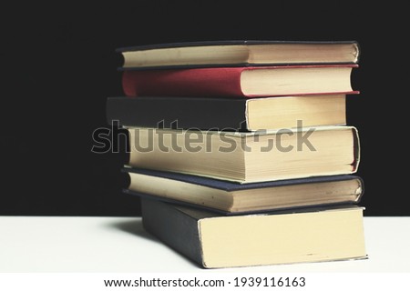 Stack of books on black background