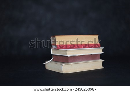 Stack of books on black background. Very nice photo of books.Illustration for books, school, study, library, science