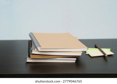 stack of books on a desk