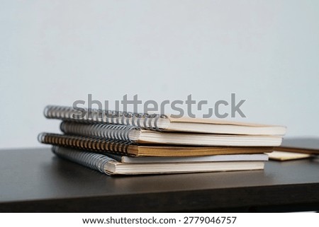 stack of books on a desk