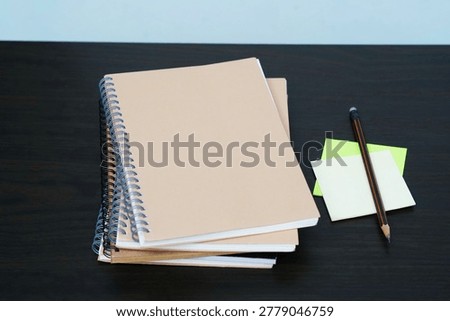 stack of books on a desk