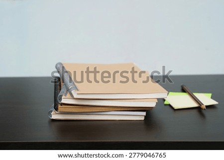 stack of books on a desk