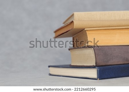 Stack of Books on gray background 