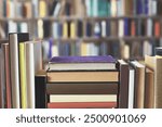 stack of books on shelf on wooden background. education and learning concept. Old historical documentary and scientific books in the library, knowledge, literature, history, School books 