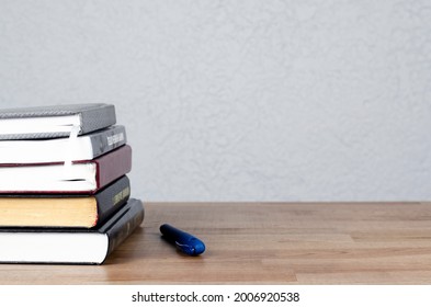 A stack of books on the table.   - Shutterstock ID 2006920538