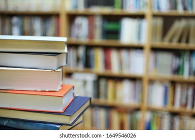 Book Stack On Wood Desk Blurred Stock Photo (Edit Now) 569895262