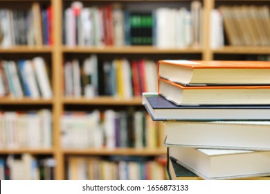 Stack Of Books On The Table In Library