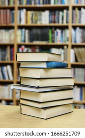 Stack Of Books On The Table In Library
