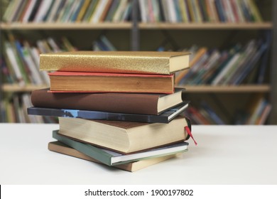 Stack Of Books On The Table In Library