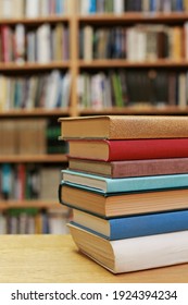 Stack Of Books On The Table In Library