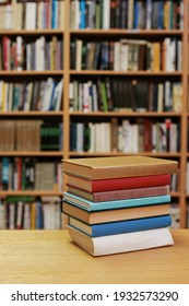 Stack Of Books On The Table In Library