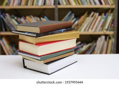 Stack Of Books On The Table In Library