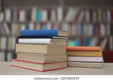 Stack of books on the table in library