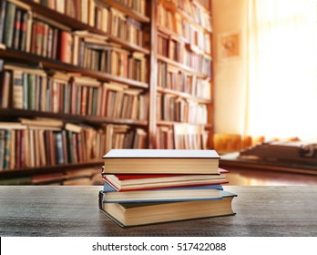 Stack of books on table at library