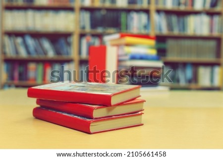 Stack of books on the table in library