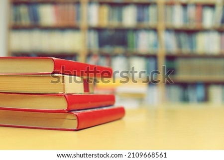Stack of books on the table in library