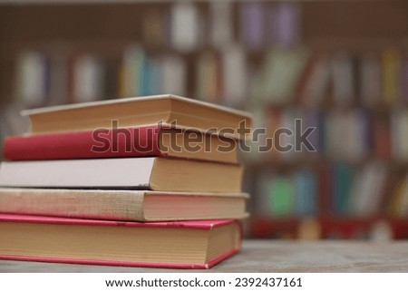 Stack of books on the table in library