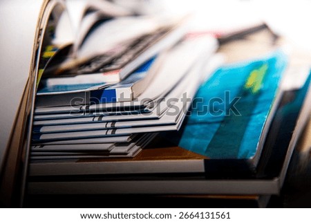 Stack of books on the table in library Shallow depth of field.