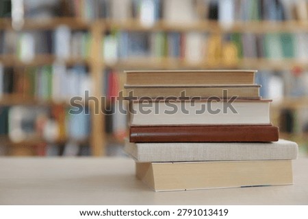 stack of books on table in library.High quality photos of books, education, Best Book Photo,
