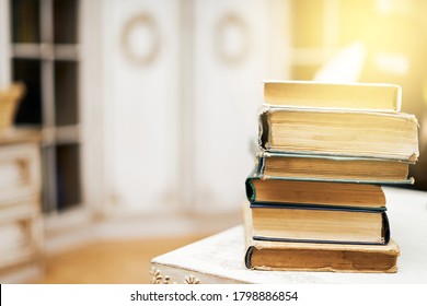 Stack of books on table, studying at home