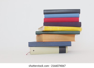 Stack of books on white